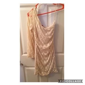 One shoulder white dress.